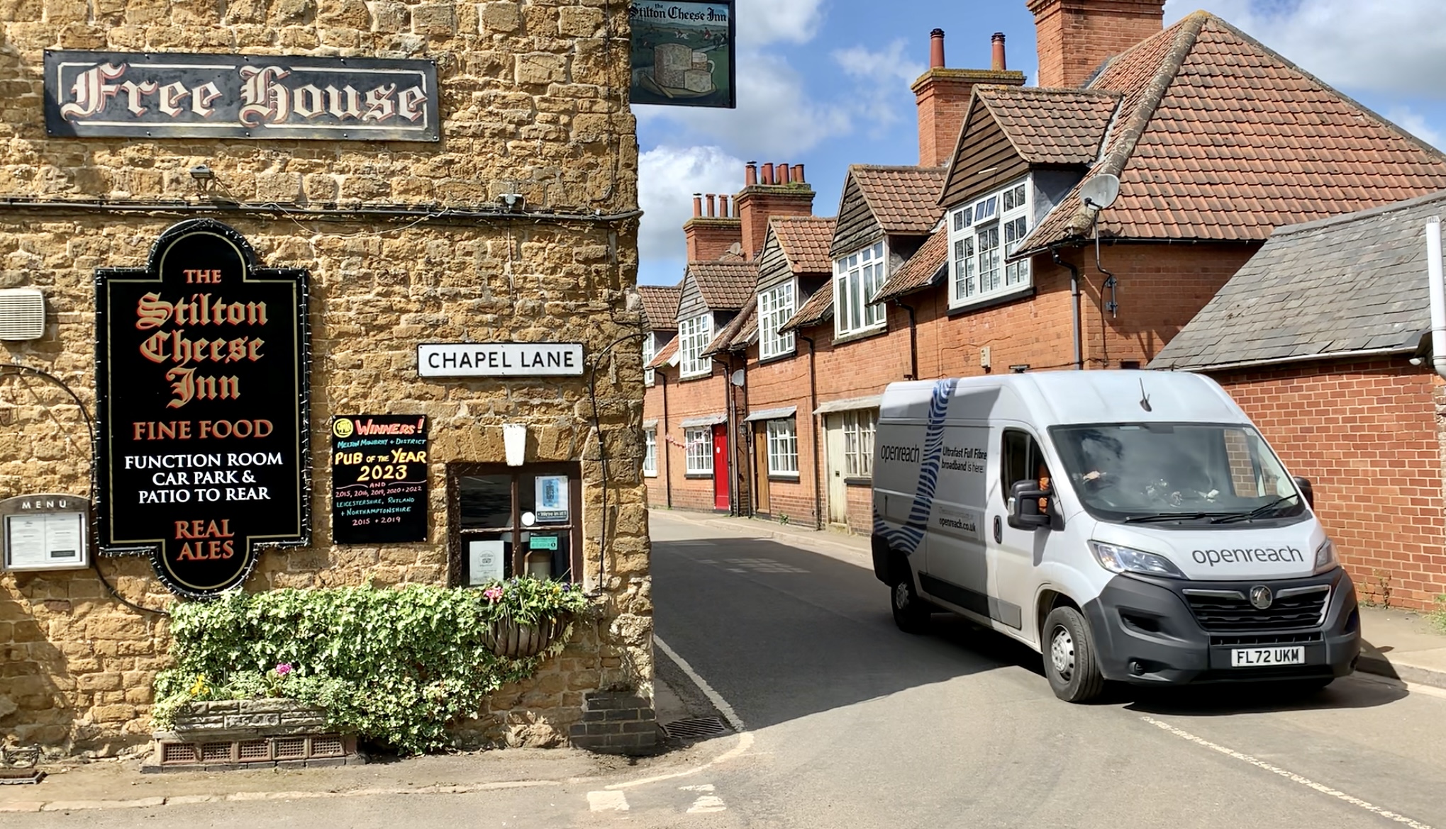 An Openreach van is next to a pub in Somerby village, Leicestershire.